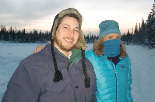 Armando and Lisa Seff walking over a frozen lake.