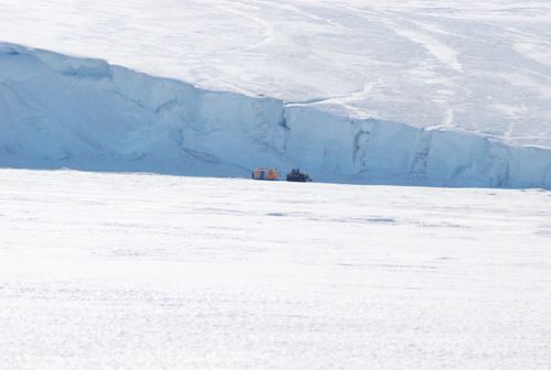A dive hut being hauled back to McMurdo  Station.