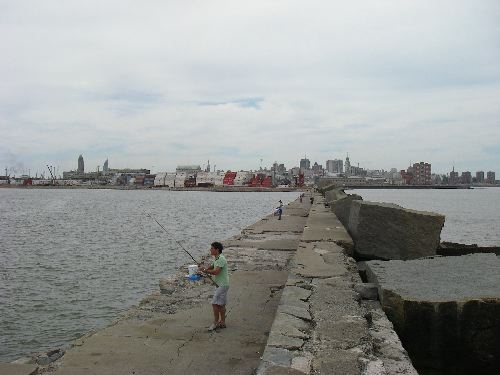 Men fishing from the breakwall pier in the Montevideo harbor
