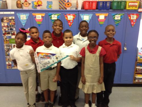 Hawkins Mill Elementary students display their flag. Photo is courtesy of Catina Roberts.