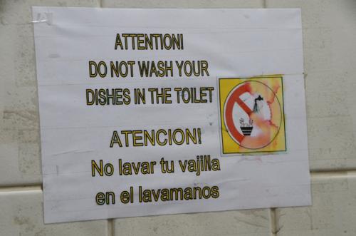 Sign for not cleaning dishes int he toilet
