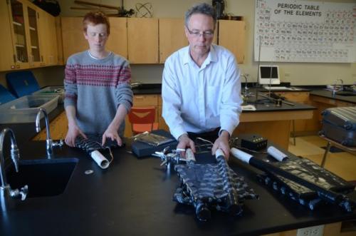 Luke working on the cosmic ray detector with Jim Madsen.