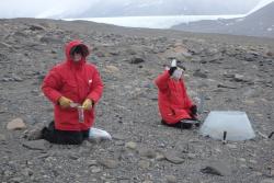 Dr. Thomas Powers and Natasha Griffin collect soil samples at the F6 site in the McMurdo Dry Valleys, Antarctica.