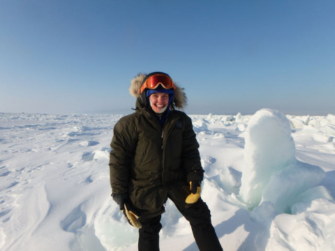 Sarah R. Johnson on the Arctic sea ice offshore of Utqiaġvik, Alaska. Photo by Ben Cohen. 