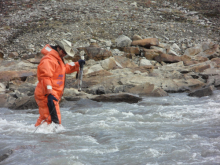 Jeremy measuring the conductivity of the glacier outlet.