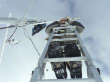 Nico on a ladder replacing the sonic sensor.