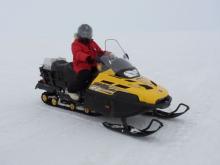 Michelle on the snowmobile