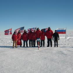 The IceCube team at the ceremonial South Pole.  The third from the right is me.