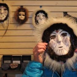 Lisa Seff wearing a mask by artist Dora Mae Buchea "Umara Nupuwhotuk" at the Museum of the North at the University of Alaska Faribanks.