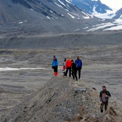 The REU students on a hike below the glacier.  What are the mounds called?