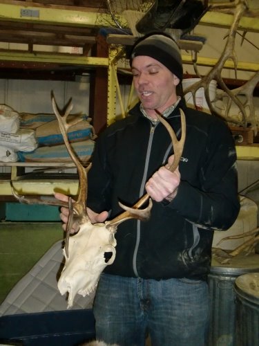 George holding reindeer skull