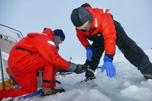 Collecting water sample on ice station