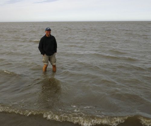 Standing in the Arctic Ocean at Prudhoe Bay.