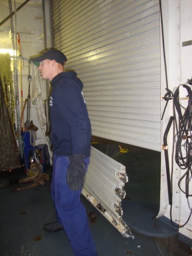 DC's working to repair the damaged Aft Staging area door