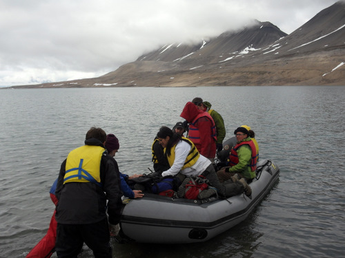 Everyone trying to fit in the boat to go back to camp.