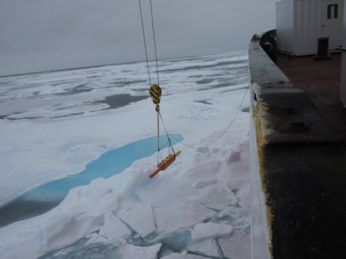 Tethered boom measuring ice thickness