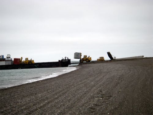 Unloading a Floating Barge on a Windy Day