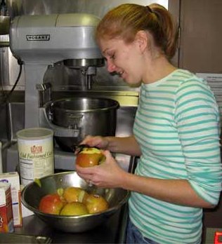 Kristen peeling apples.