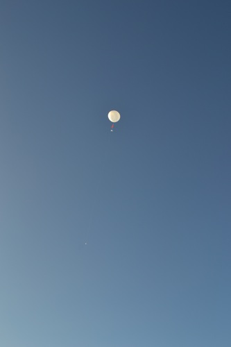 Weather Balloon Quickly Ascending Over Summit Greenland