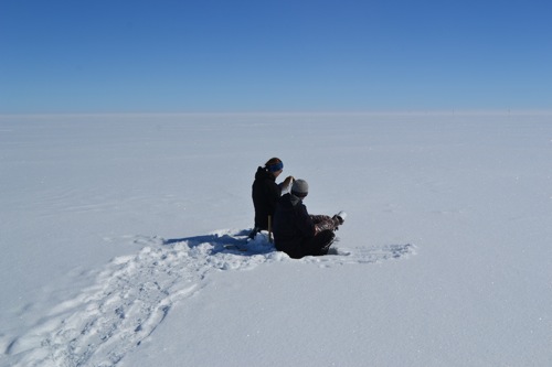 Brandon Strellis and Hannah James collecting the last snow sample