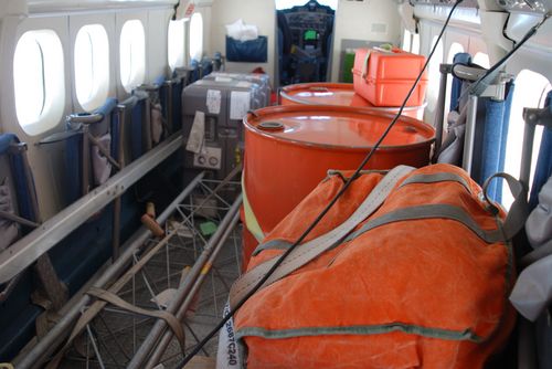 Fuel drums and cargo inside the Twin Otter