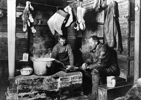 Cecil H Meares and Dimitri Geroff by the blubber stove in the Discovery hut