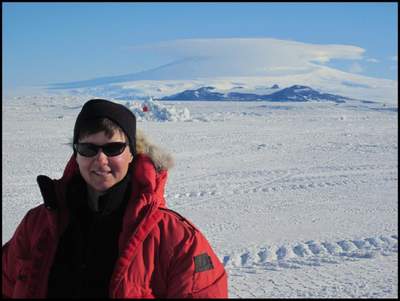 Lynette Barna with Mt. Erebus in the background.