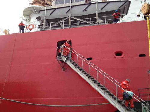 Disembarking: Scientists walking down the gangplank from the Healy.
