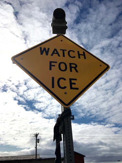 Watch For Ice sign on the street in Nome Alaska.  Photo by Lisa Seff.  August 23, 2017.