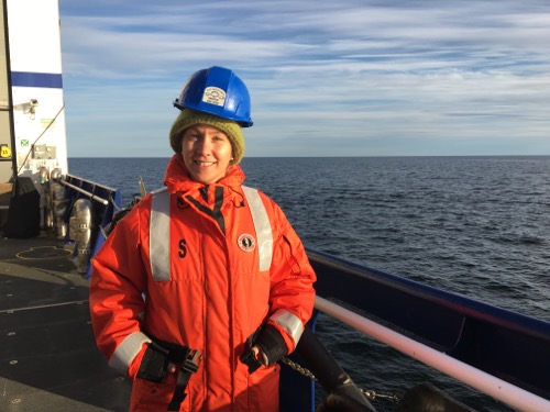 Dr. Kristina Kvile on the deck of the R/V Sikuliaq!
