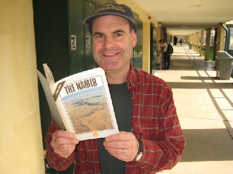 PolarTREC Teacher Michael Wing reads a book about Namibia