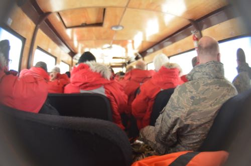 Many red coats inside Ivan the Terra Bus.