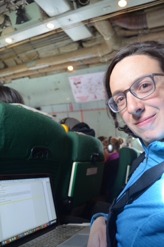 Michelle Brown writing journal on plane
