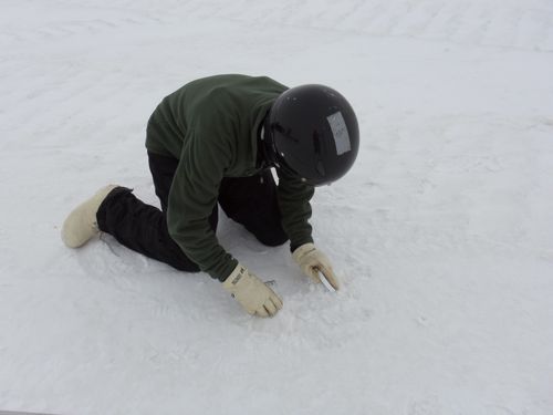 Terry collects a snow sample