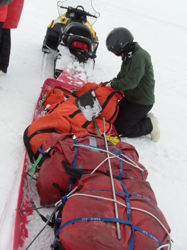 Sled with survival kits