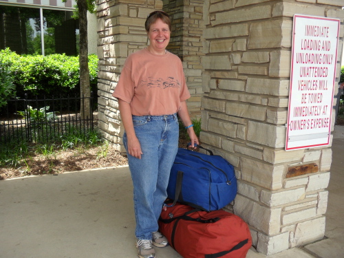 Susan Steiner with two gear bags ready to fly out of Asheville, NC to Fairbanks 