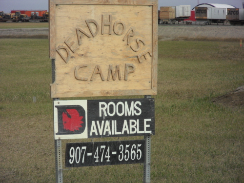 sign at Deadhorse Camp, lodging and meeting place for Northern Alaskan Tour Comp