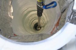 A hole drilled for a string of IceCube light detectors. Photo by Casey O&#39;Hara.