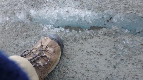 Boot Pointing at Ice