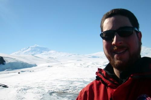 Selfie photograph with Mt. Erebus in the background.