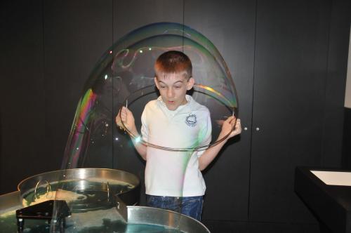 Garrett makes a big bubble around himself in the Anchorage Museum