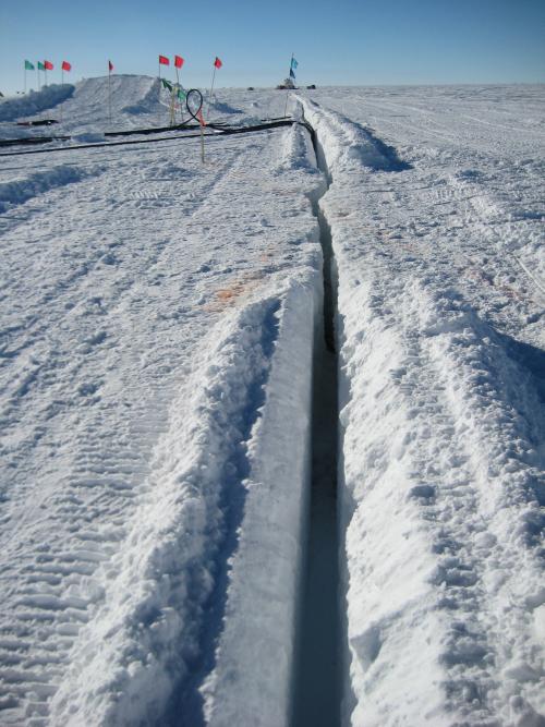Deep trenches are cut for the massive cables to connect to the IceCube Lab.