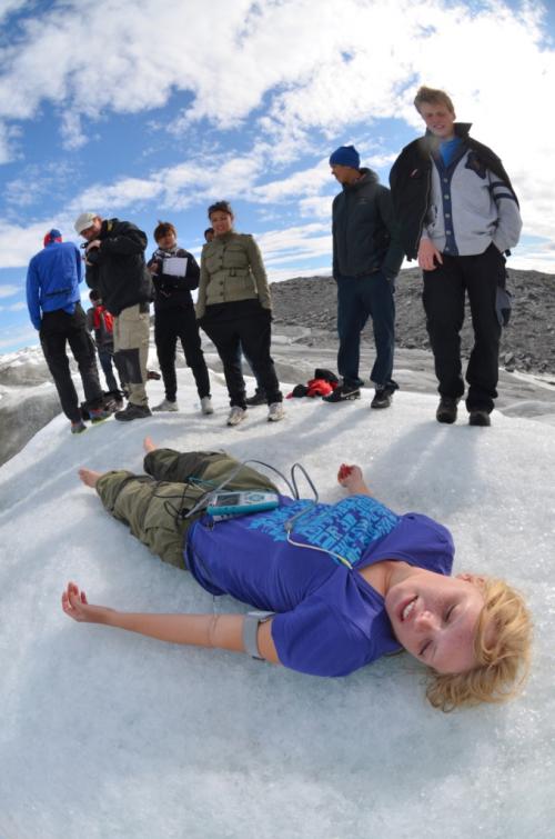 Rebecca tests her body's response to laying on the ice.