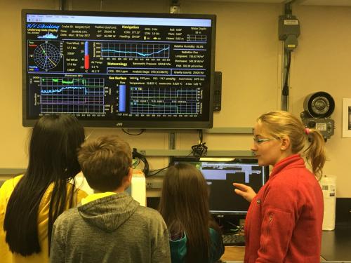 Anvil City Science Academy middle school students learn about phytoplankton with Dr. Lowry onboard the R/V Sikuliaq. Photo by Lisa Seff.  September 18, 2017.