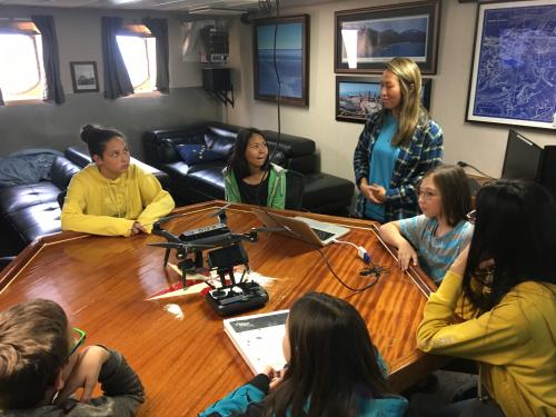 Anvil City School Science Academy school students learn about drones from Jennifer Johnson onboard the R/V Sikuliaq. Photo by Lisa Seff.  September 18, 2017.