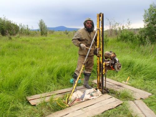 Dr. Sasha Kholodov drills the second borehole at Pleistocene Park.