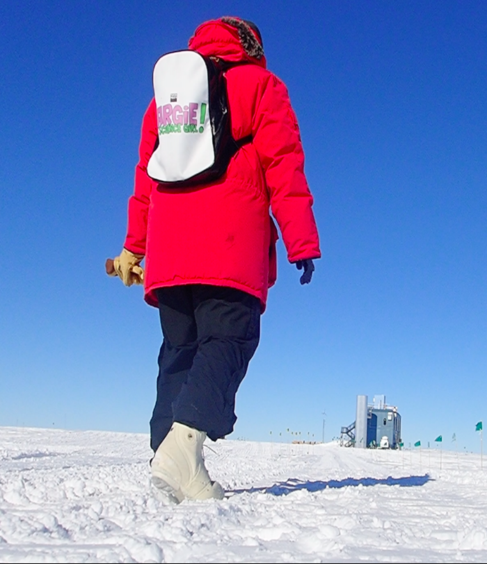 Jocelyn Argueta walking to the IceCube Laboratory