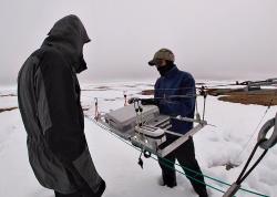 Steve Oberbauer and Jeremy May set up the Mobile Instrumented Sensor Platform (MISP) tram. Utqiaġvik, Alaska.