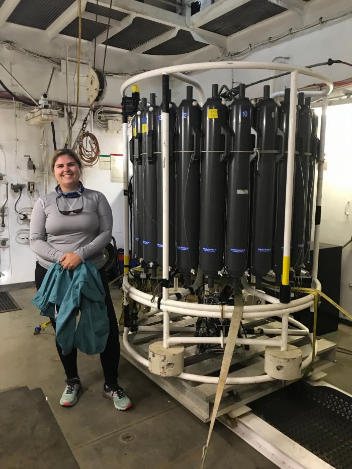 Piper Bartlett-Browne next to the CTD in the loading dock before deployment.