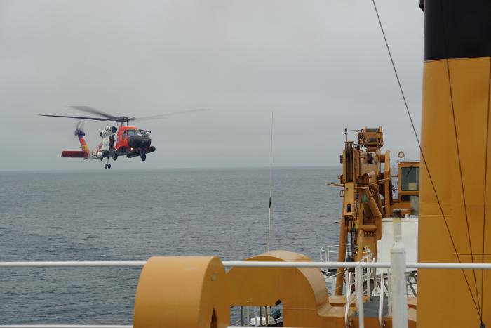 Helicopter landing on the helo deck of the USCGC Healy.